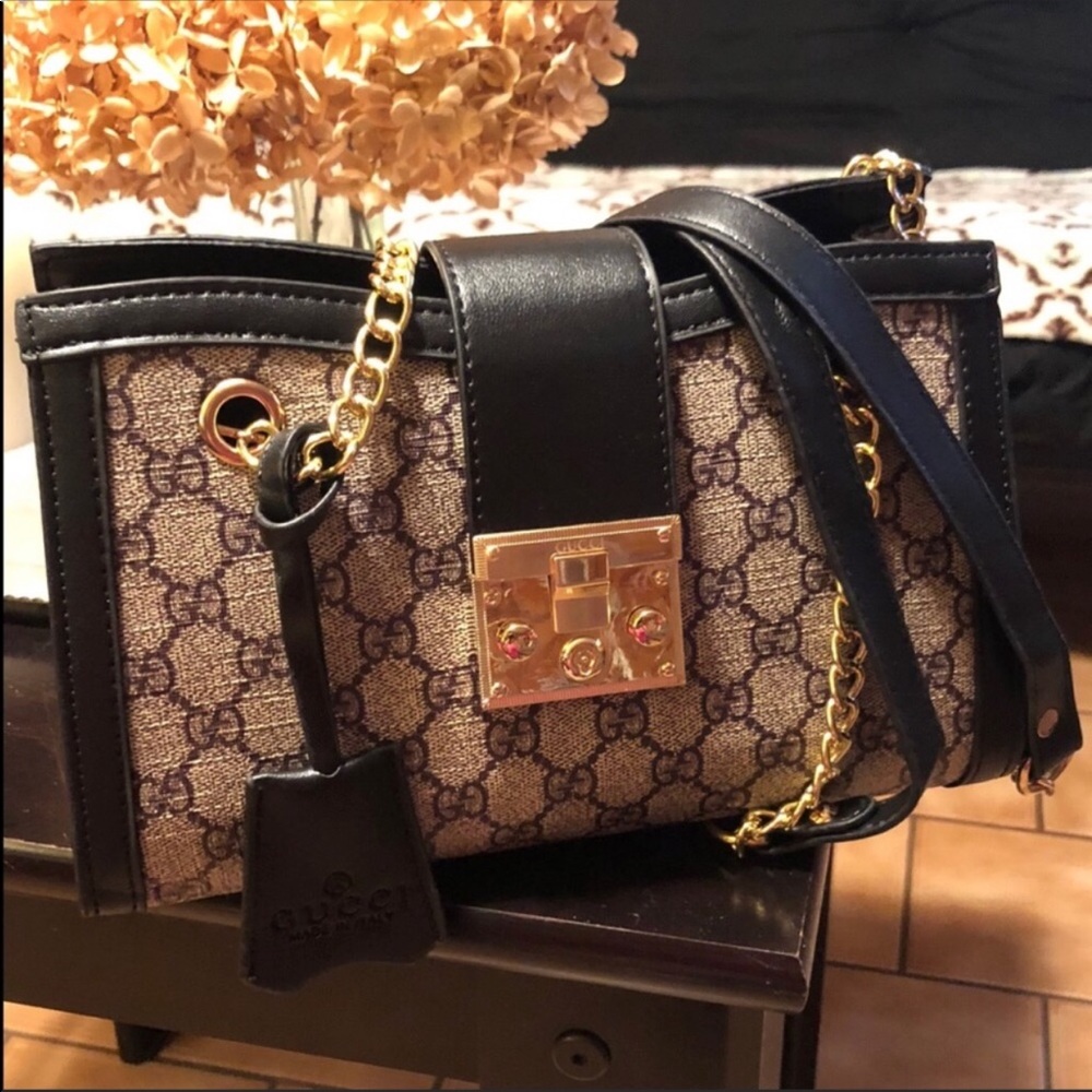 Padlock inspired chain bag